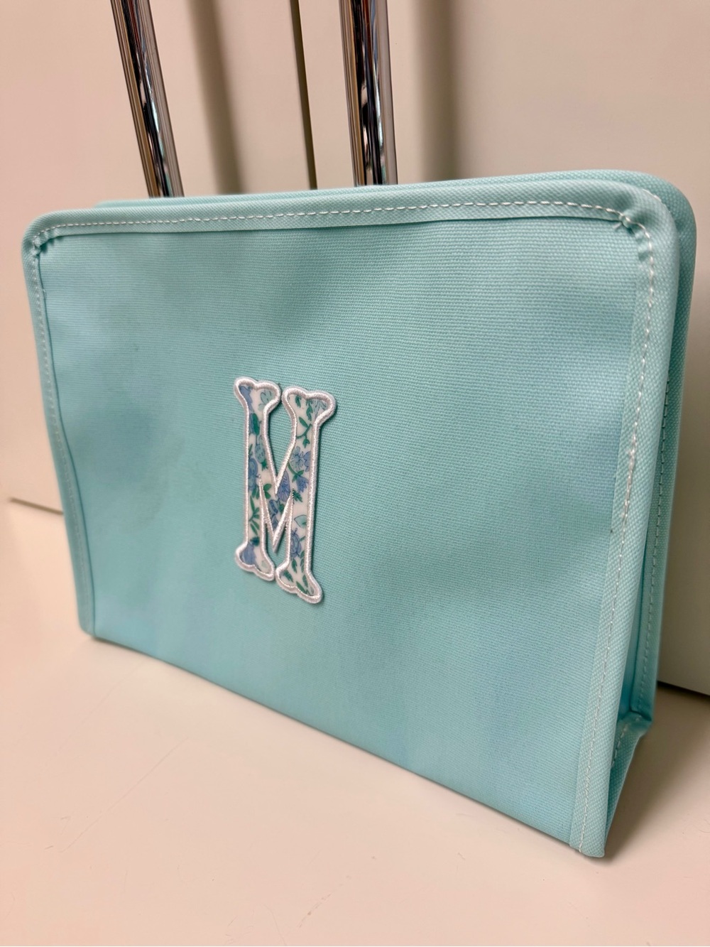 TRVL Design Turquoise Monogram Cosmetic Pouch with Decorative 'M'